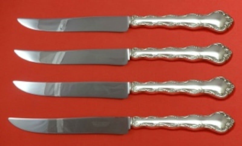 Reed & Barton Tara Sterling Silver Steak Knife Set 4pc Texas Sized 9.5": Reed & Barton Tara Sterling Silver Steak Knife Set 4pc Texas Sized 9.5" Elevate your dining experience with this impressive 4-piece steak knife set from Reed & Barton, featuring the Tara pattern. Each