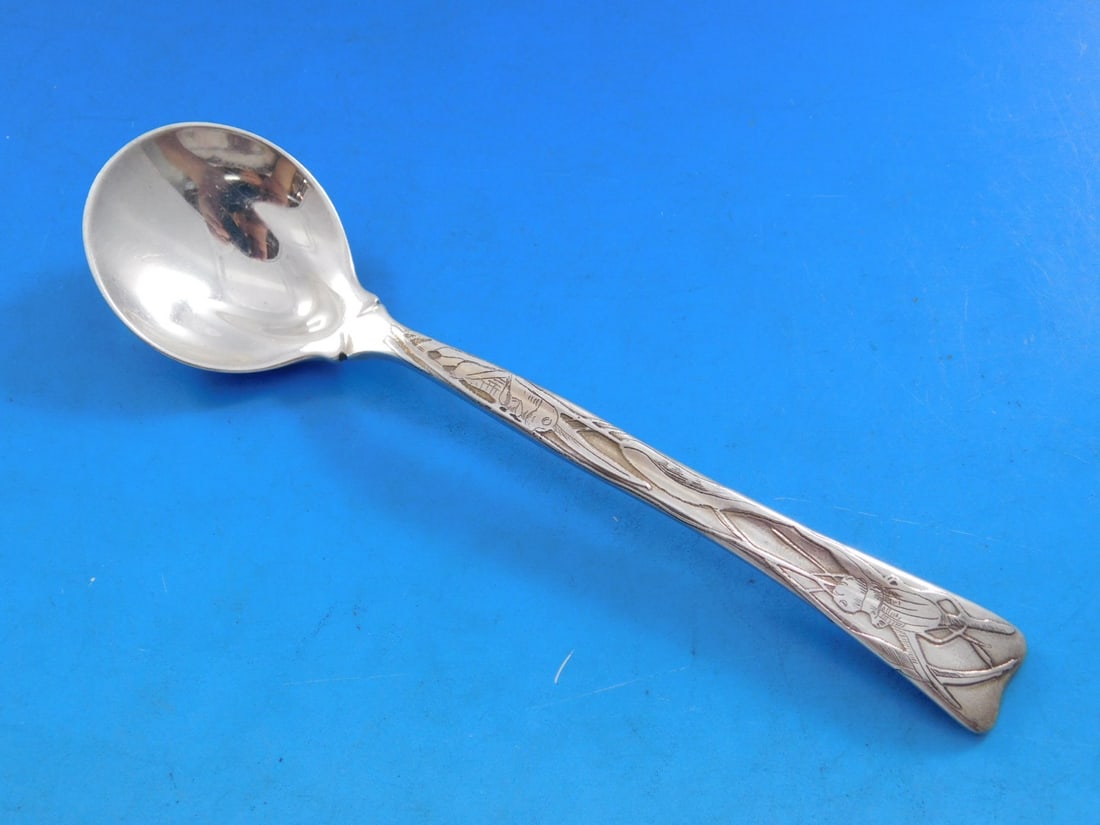 Tiffany & Co Lap Over Edge Sterling Silver Sherbet Spoon 5.5 Inch Cricket Motif: Tiffany & Co Lap Over Edge Sterling Silver Sherbet Spoon 5.5 Inch Cricket Motif This exquisite sterling silver sherbet spoon, crafted by Tiffany & Co., features a unique lap over edge design with intr