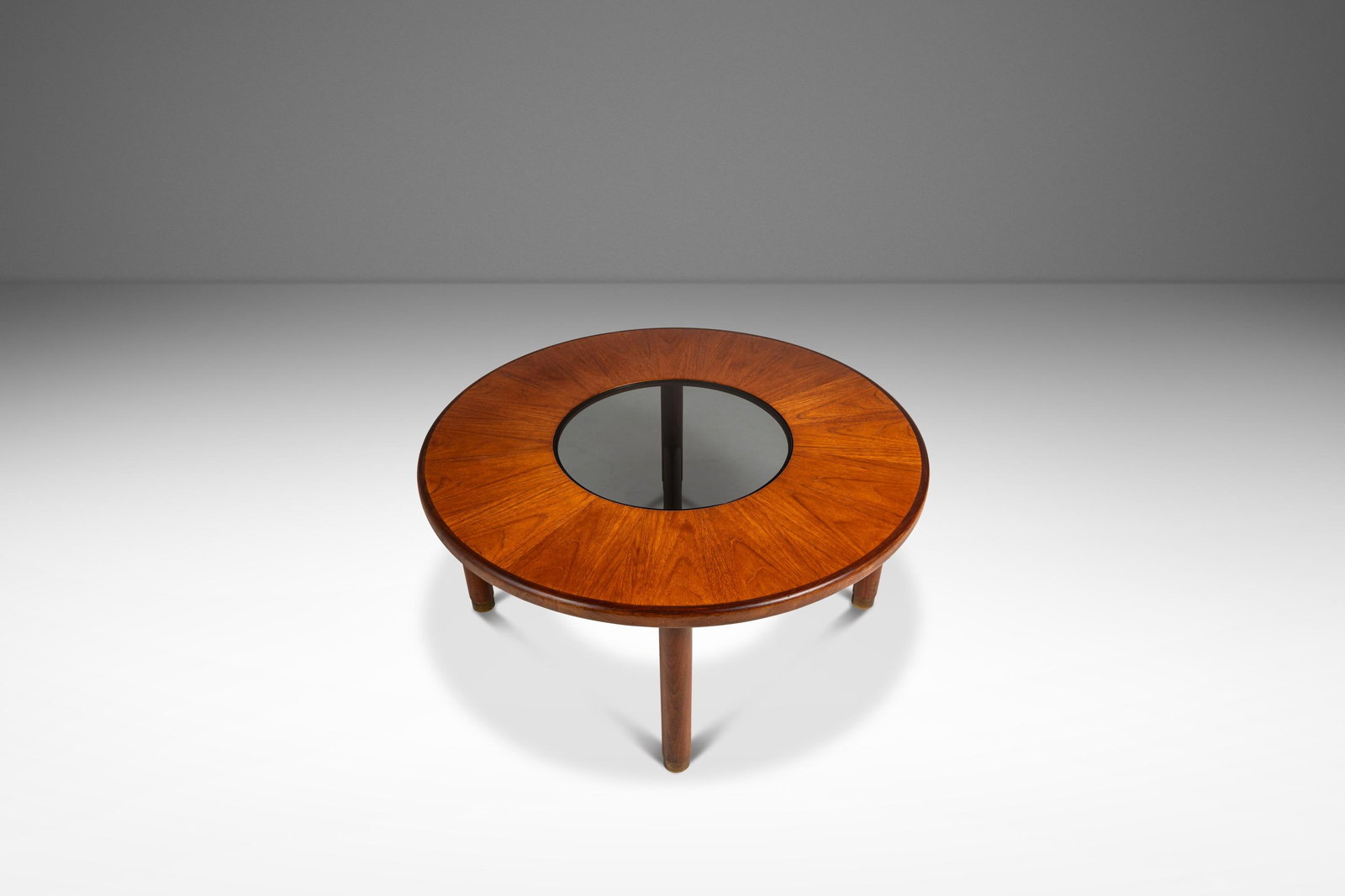 Teak Coffee Table With Glass Center and Brass Accents Attributed to G-Plan 1970s: Teak Coffee Table With Glass Center and Brass Accents Attributed to G-Plan 1970s This Mid-Century Danish Modern "Donut" coffee table, designed by V.B. Wilkins for G-Plan in England during the 1970s, f
