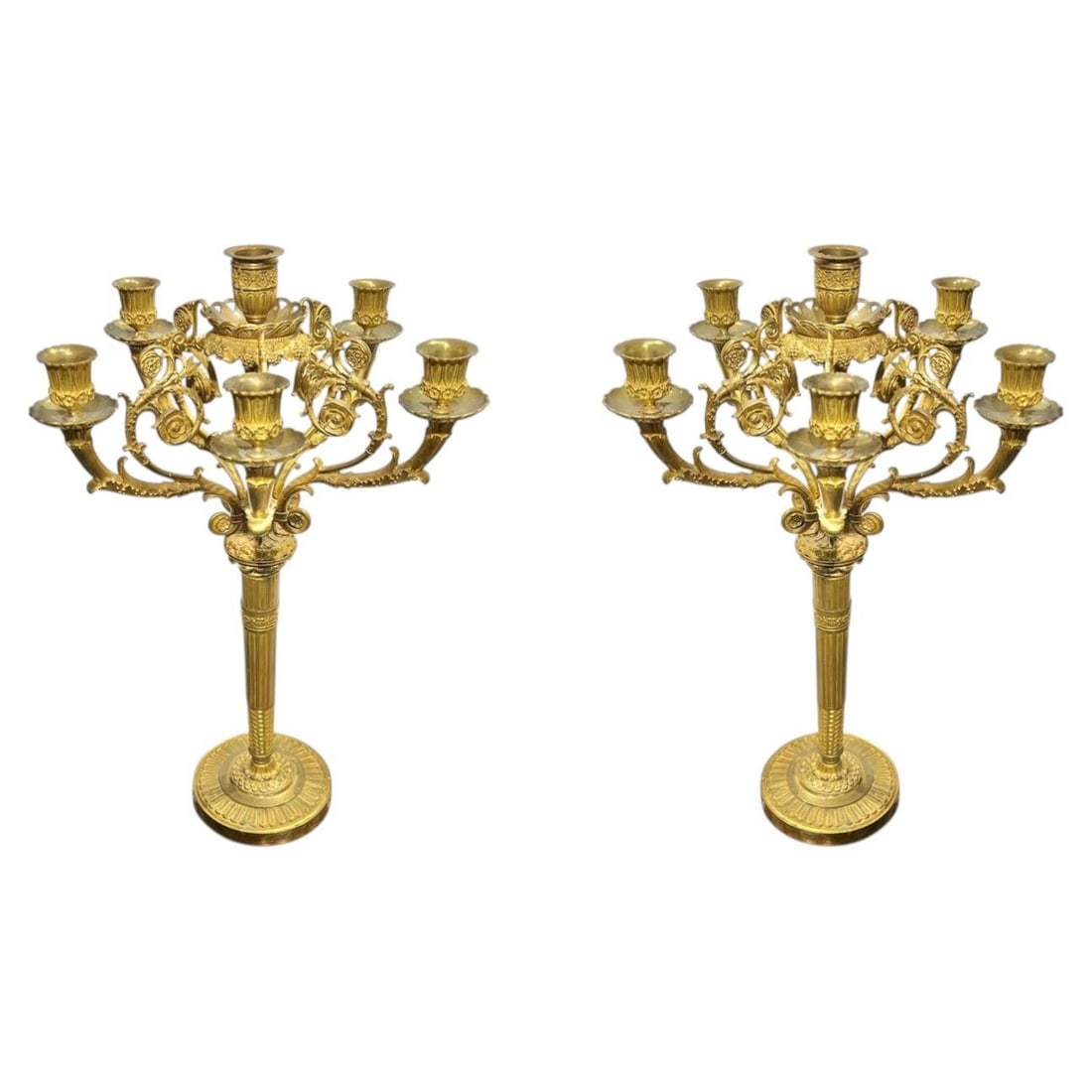 Set of 2 French Empire Gilt Bronze Six-Light Candelabra: Set of 2 French Empire Gilt Bronze Six-Light Candelabra This pair of antique French Empire style candelabra dates to the 19th century and features a gilt bronze construction. Each candelabrum offers s