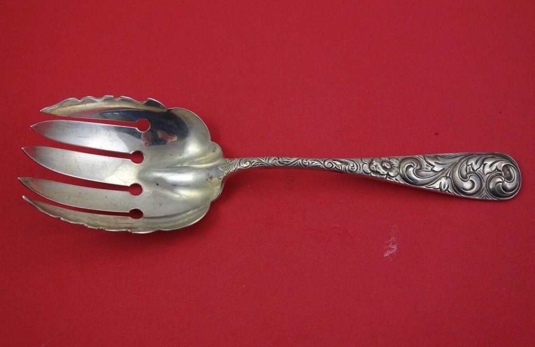 Durgin Scroll Sterling Silver Vegetable Serving Fork 9.25": Durgin Scroll Sterling Silver Vegetable Serving Fork 9.25" This exquisite vegetable serving fork from Durgin showcases the elegant Scroll pattern, exuding timeless charm. Crafted from high-quality ste