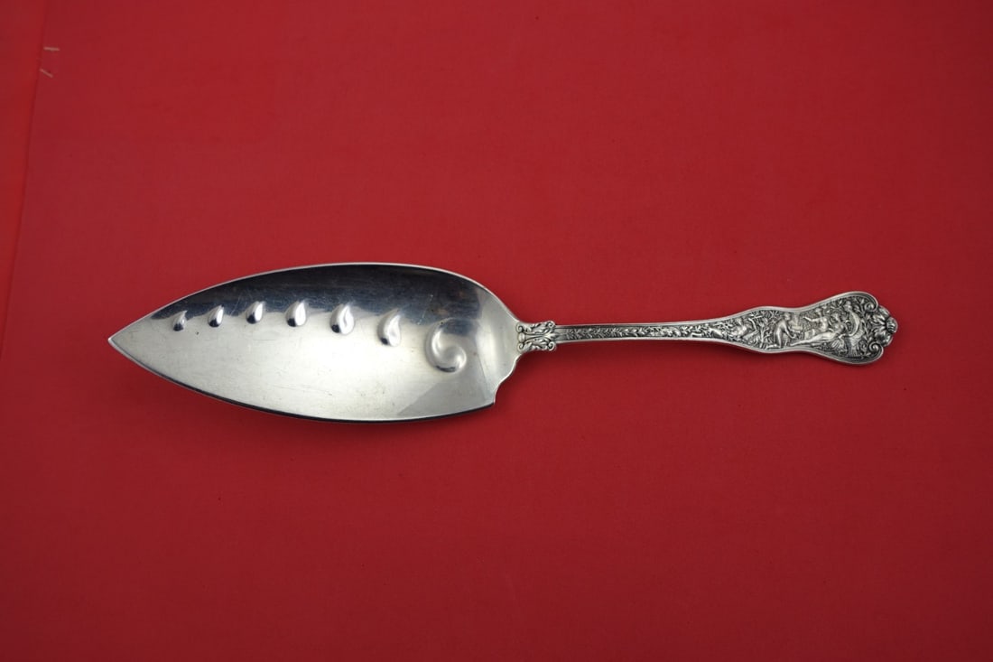 Tiffany & Co Olympian Sterling Silver Fish Server 11 1/4: Tiffany & Co Olympian Sterling Silver Fish Server 11 1/4 Introducing the Olympian Fish Server by Tiffany & Co., a stunning piece of sterling silver flatware that reflects the artistry of classical myt