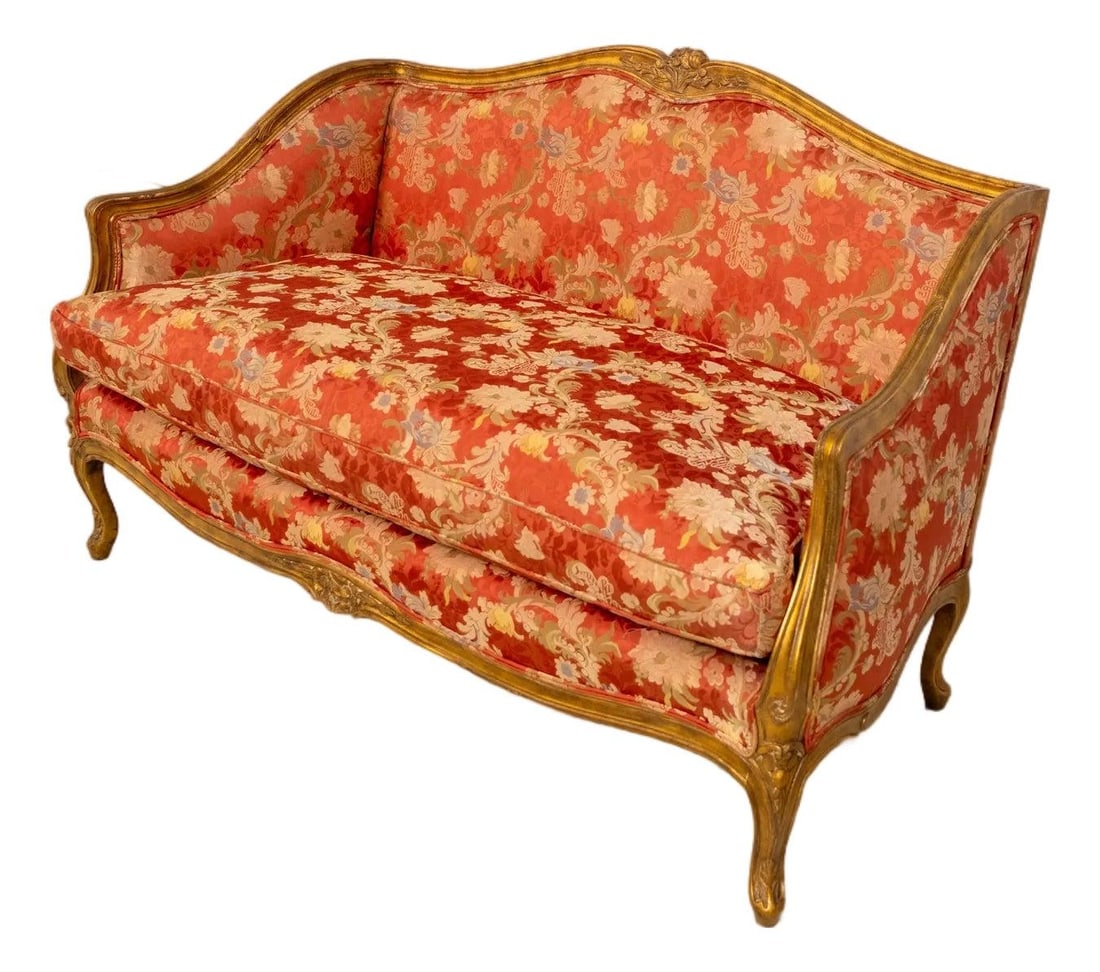 French Style Giltwood Settee with Floral Silk Upholstery by Meyer Gunther: French Style Giltwood Settee with Floral Silk Upholstery by Meyer Gunther This Louis XVI style giltwood settee loveseat features finely carved floral crest details and high-quality construction. The u