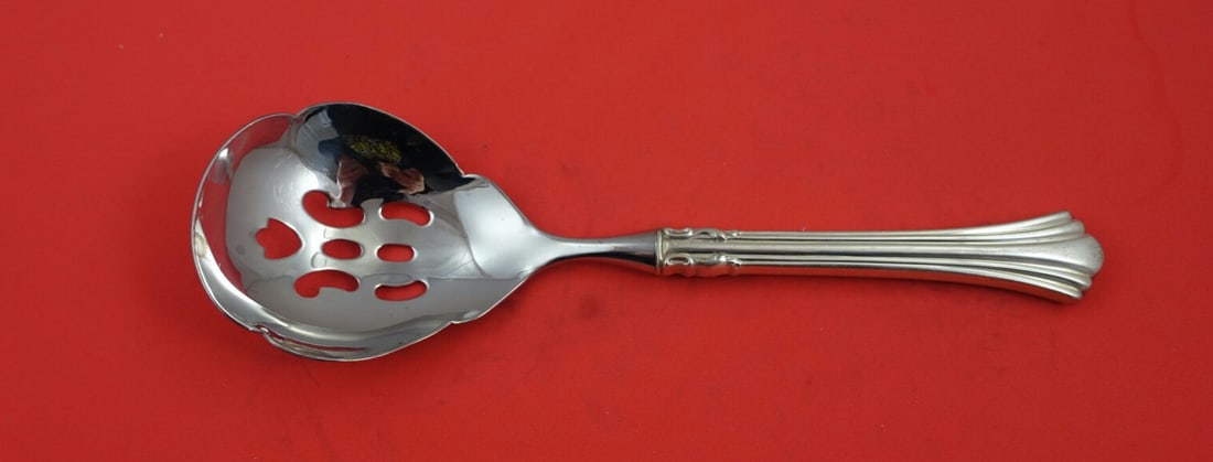 Reed & Barton Eighteenth Century Sterling Silver Pierced Casserole Spoon 9 1/8": Reed & Barton Eighteenth Century Sterling Silver Pierced Casserole Spoon 9 1/8" Enhance your dining experience with this exquisite Eighteenth Century serving spoon by Reed & Barton. Crafted from high-