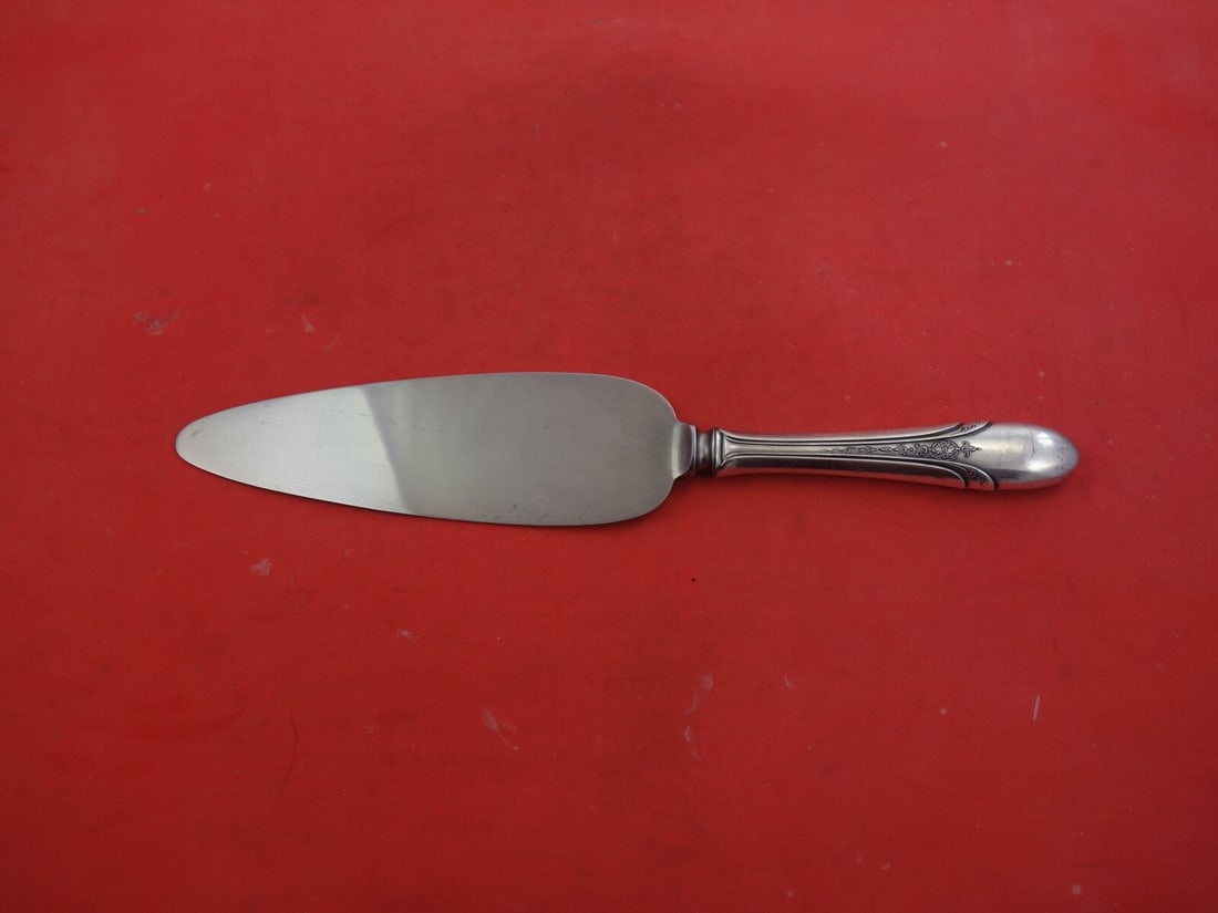 Towle Sterling Silver Cake Server Symphony Chased 9.5 Inch: Towle Sterling Silver Cake Server Symphony Chased 9.5 Inch Exquisite Towle Sterling Silver Cake Server in the Symphony Chased pattern. This elegant piece, measuring 9 1/2 inches, showcases a beautiful