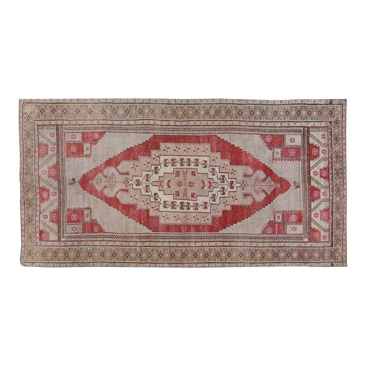 Hand-Knotted Wool Anatolian Rug in Burgundy 5'2'' x 10'3'': Hand-Knotted Wool Anatolian Rug in Burgundy 5'2'' x 10'3'' This vintage Turkish Anatolian rug is hand-knotted from wool using traditional techniques. Showcasing a rich burgundy color and a detailed te