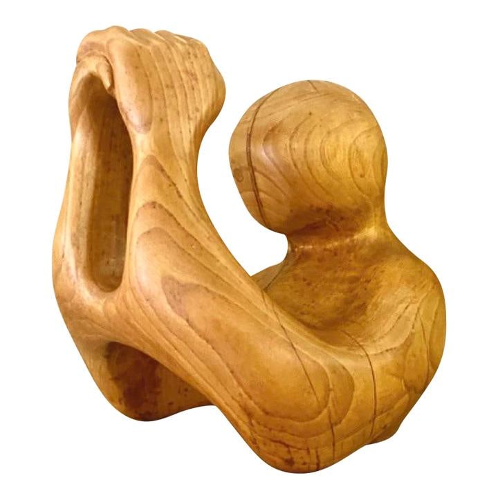 Vintage Hand Carved Wood Abstract Sculpture in Chocolate Finish: Vintage Hand Carved Wood Abstract Sculpture in Chocolate Finish This vintage hand carved wood sculpture showcases a stunning abstract figure in prayer, radiating beauty and serenity. The piece feature
