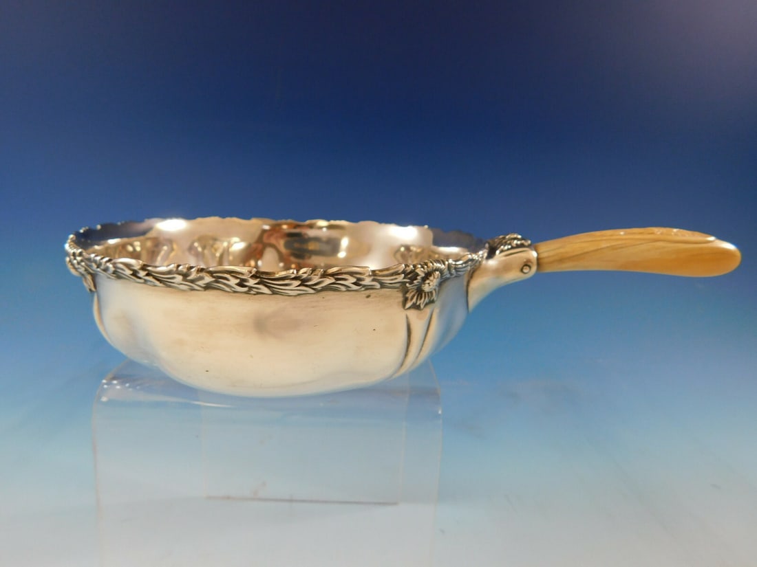 Sterling Silver Chrysanthemum Porringer Bowl by Tiffany & Co Antique: Sterling Silver Chrysanthemum Porringer Bowl by Tiffany & Co Antique This antique Tiffany & Co. Chrysanthemum pattern porringer bowl is crafted from sterling silver and features a distinctive handle a