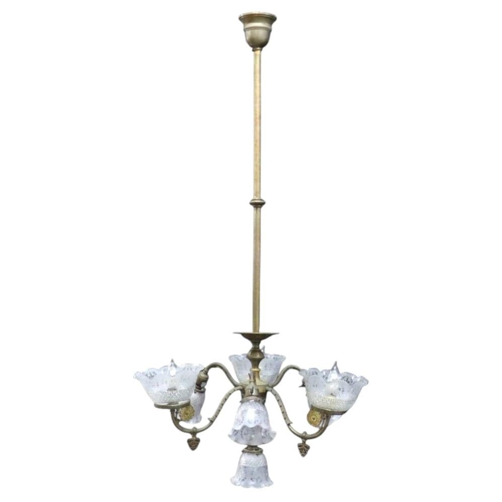 c1890 7-Light Brass Chandelier with Diamond Cut Ruffled Glass Shades: c1890 7-Light Brass Chandelier with Diamond Cut Ruffled Glass Shades Late 19th century brass chandelier dating to circa 1890, designed for both electric and gas illumination. It features seven lights 