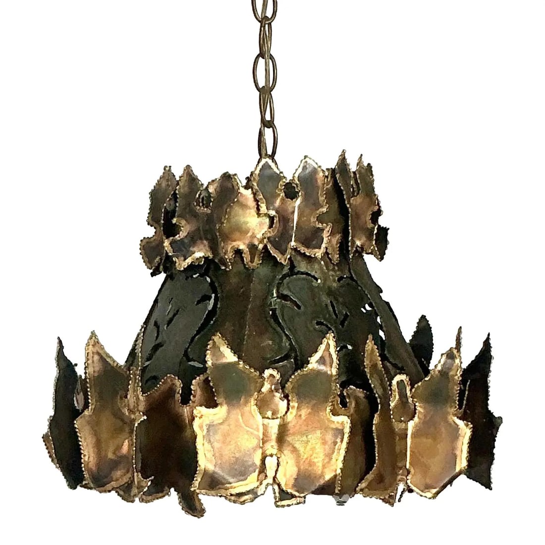 Brutalist Torch Cut Metal Pendant Inspired by Tom Greene 17x17x12 Inch: Brutalist Torch Cut Metal Pendant Inspired by Tom Greene 17x17x12 Inch This vintage mid-century chandelier is a striking example of Brutalist design from the 1960s, influenced by artists such as Tom G