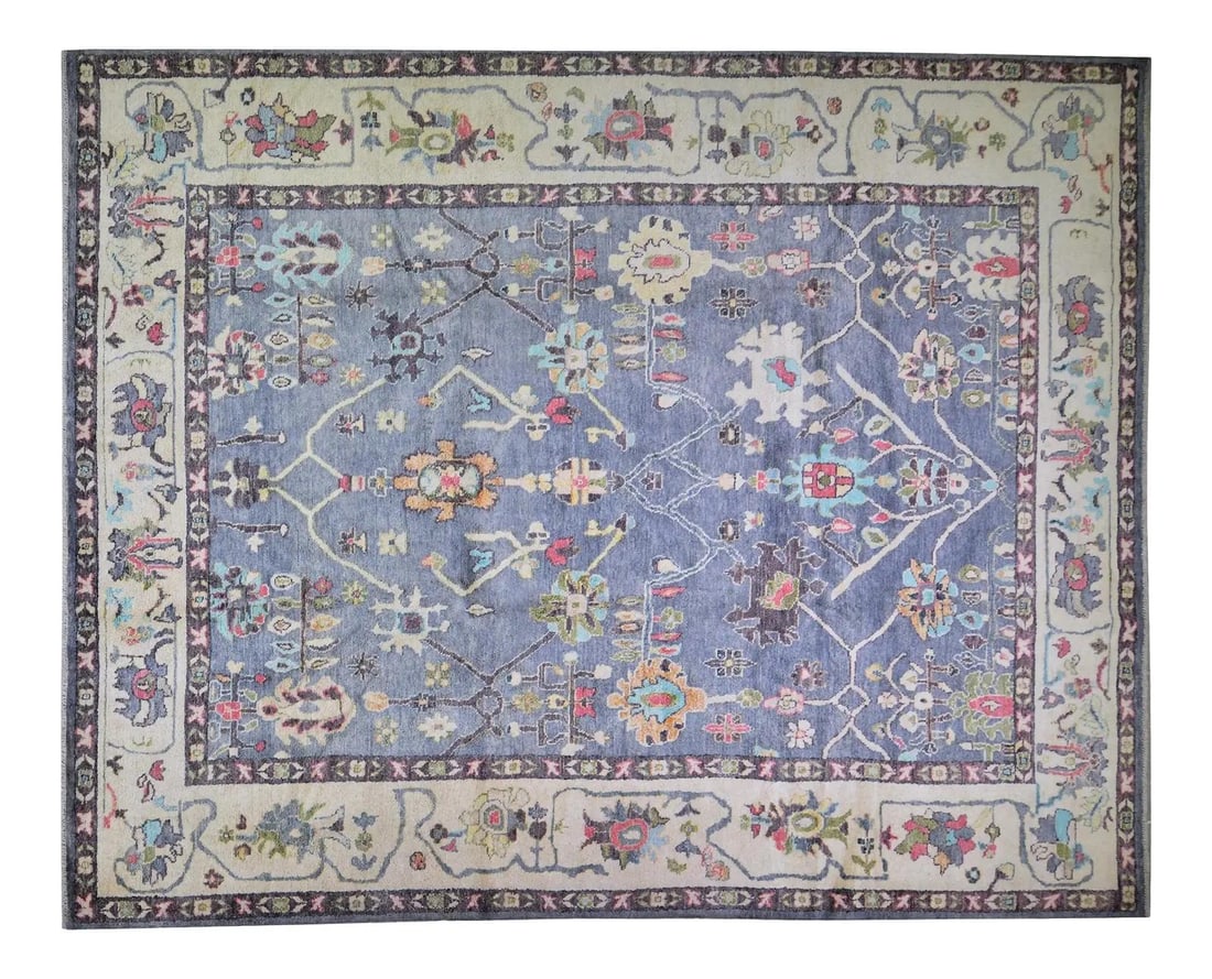 Oushak Angora Wool Rug Hand Knotted in Natural Blue 9'3" x 11'8": Oushak Angora Wool Rug Hand Knotted in Natural Blue 9'3" x 11'8" This vintage Turkish Oushak rug is hand knotted from natural color Angora wool, featuring an all-over design. The rug displays a blue c