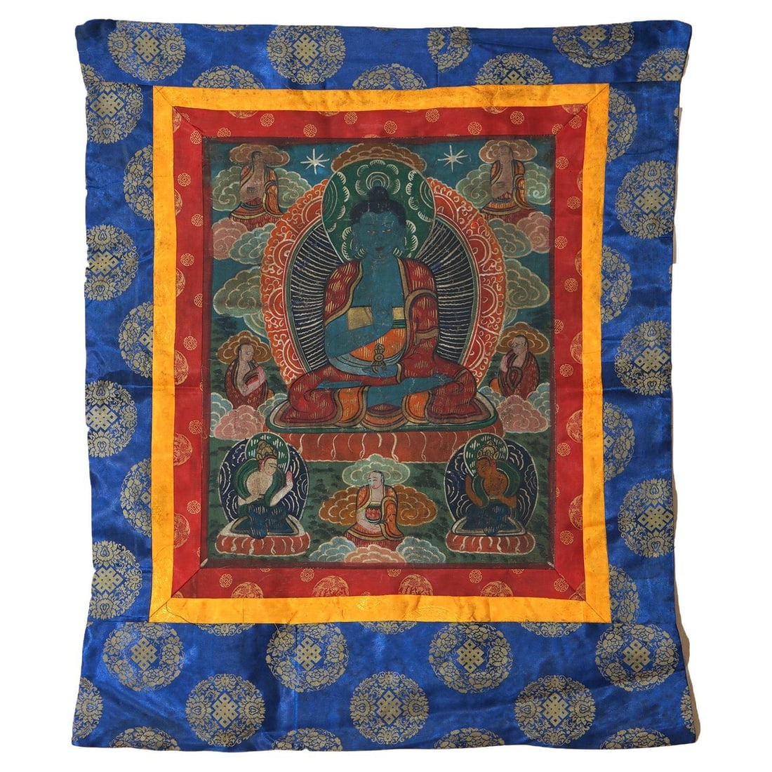 Early 20th Century Tibetan Silk Canvas Thangka Depicting Figures 36 x 30.75 Inches: Early 20th Century Tibetan Silk Canvas Thangka Depicting Figures 36 x 30.75 Inches This antique Tibetan Thangka, created around 1920, showcases traditional Buddhist art with hand-painted figures on si