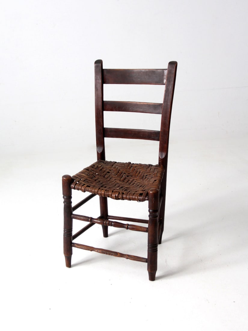 Rustic Antique Wooden Chair with Herringbone Splint Weave Seat: Rustic Antique Wooden Chair with Herringbone Splint Weave Seat This antique splint weave seat chair showcases a rustic wooden design, featuring a classic ladder back and a beautifully woven seat with 
