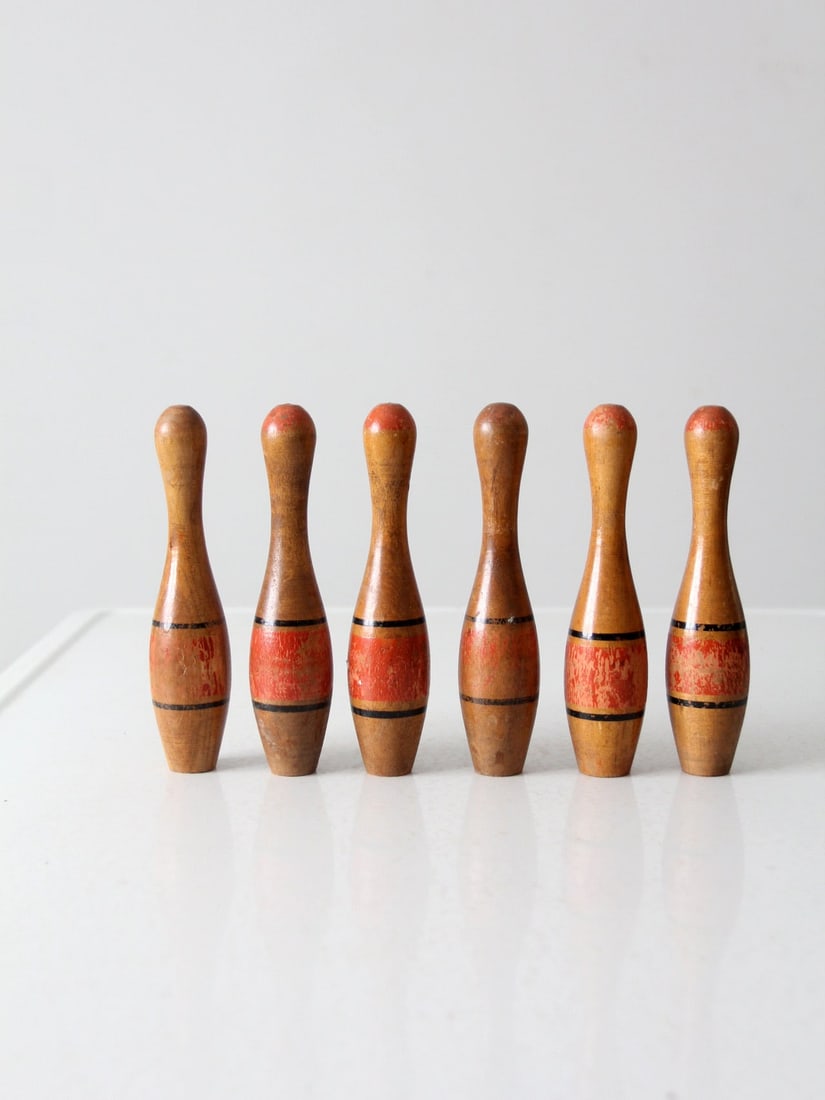 Set of 6 Antique Wooden Skittles with Blue and Red Stripes: Set of 6 Antique Wooden Skittles with Blue and Red Stripes This charming set of six antique wooden skittles features a classic design with blue and red stripes, showcasing a beautiful patina and natur