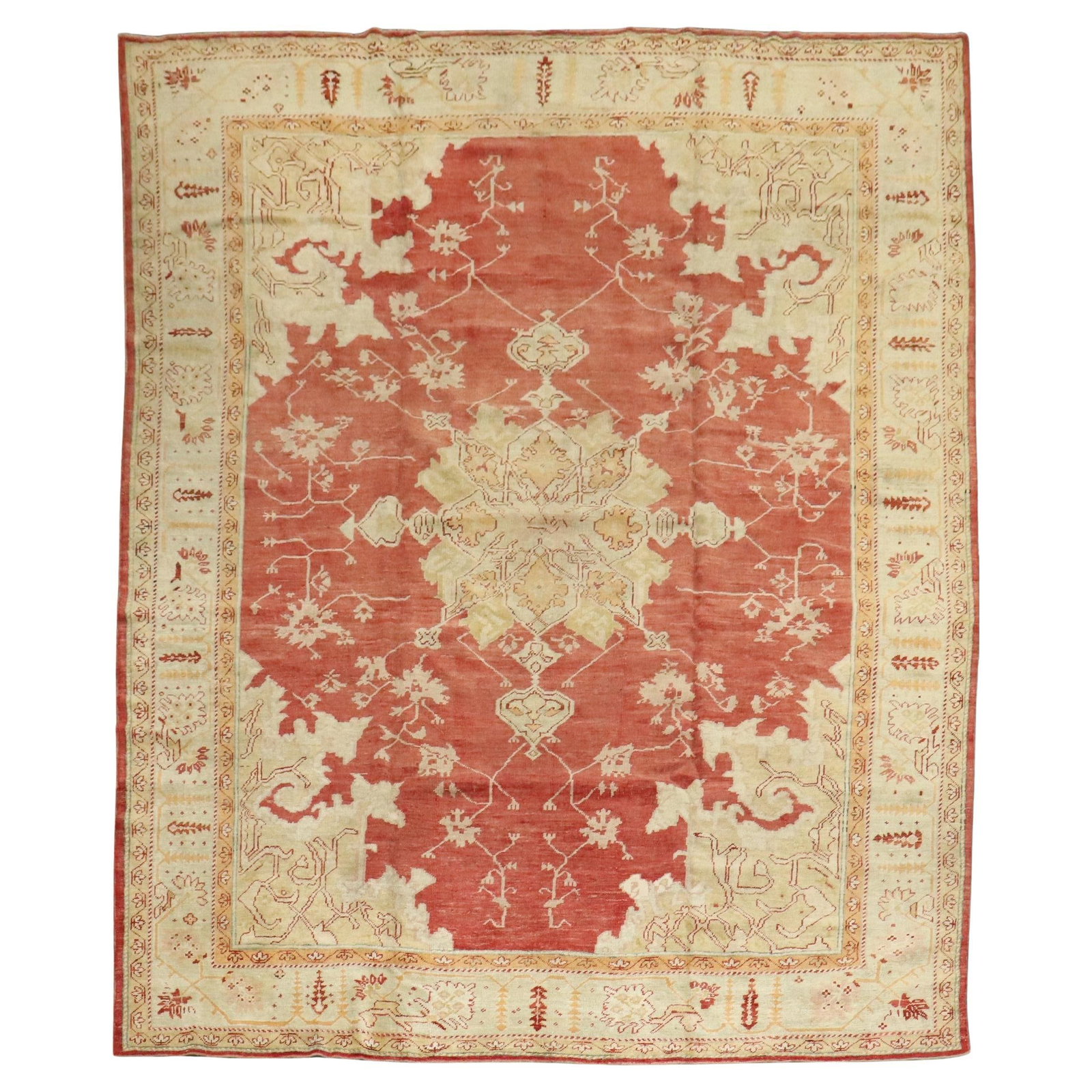 Early 20th Century Turkish Oushak Wool Rug 9'6 x 11'11: Early 20th Century Turkish Oushak Wool Rug 9'6 x 11'11 This is an early 20th century Turkish Oushak rug featuring a red background with an ivory and gold central medallion and border. Hand-woven from 