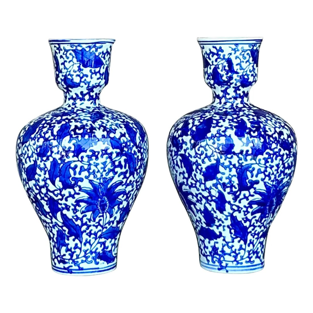 Pair of Vintage Asian Blue White Porcelain Vases with Leaf Motifs: Pair of Vintage Asian Blue White Porcelain Vases with Leaf Motifs Enhance your decor with this exquisite pair of vintage Asian blue and white vases. Each vase is hand-painted with intricate leaf and v