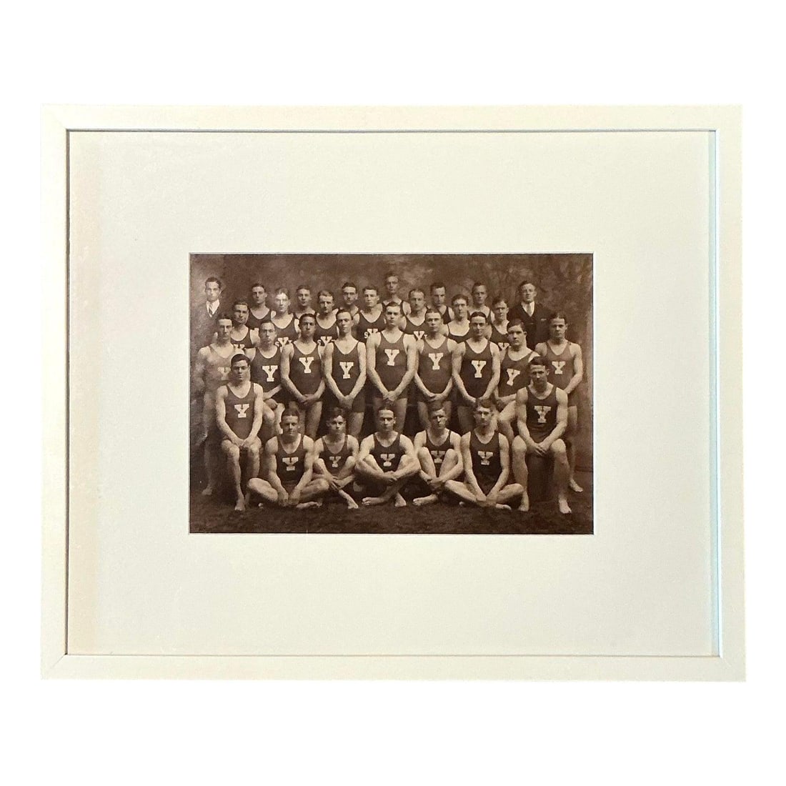 Framed Sepia Photograph Yale University Swim Team Early 20th Century: Framed Sepia Photograph Yale University Swim Team Early 20th Century This vintage sepia-toned photograph features the Yale University swim team, likely from the early 20th century. The group portrait 