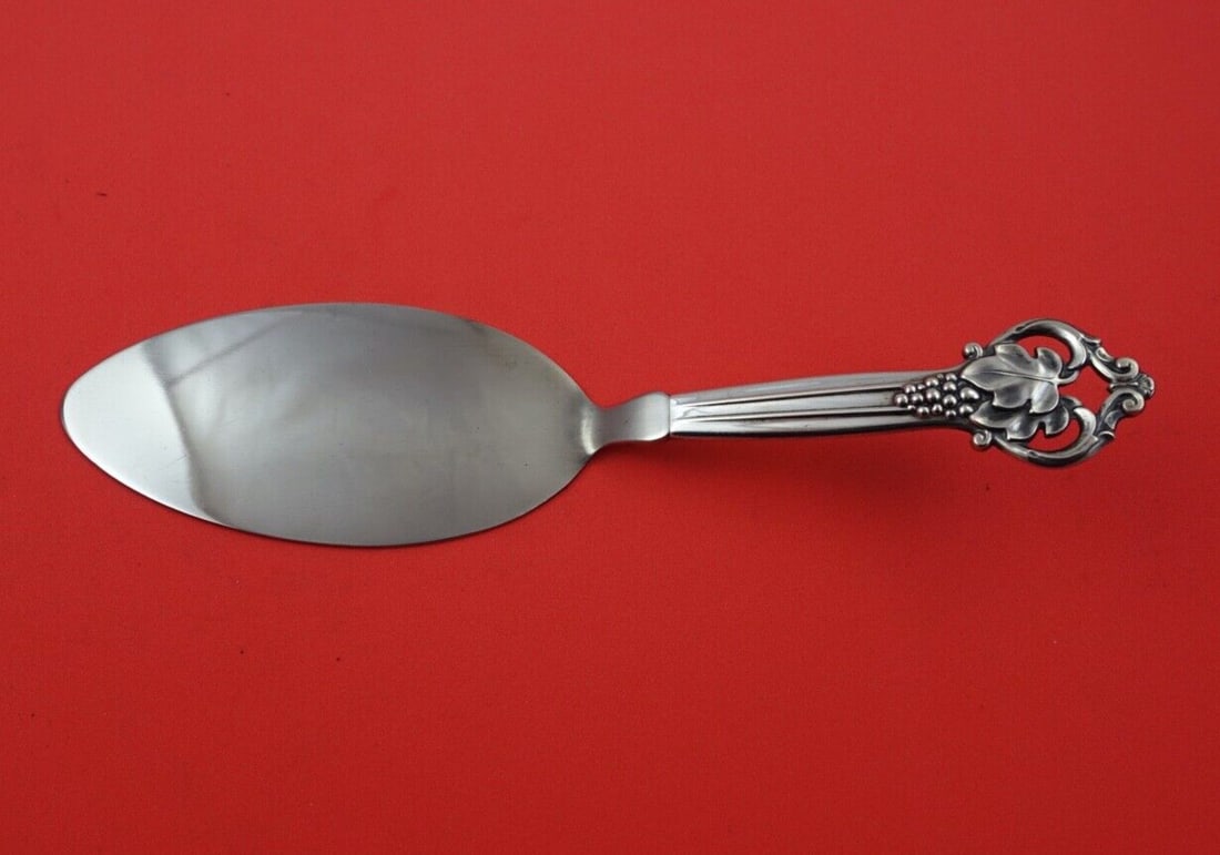 Cohr Sterling Silver Pastry Server 8.5 Inches Grape Design: Cohr Sterling Silver Pastry Server 8.5 Inches Grape Design This exquisite pastry server, crafted by Cohr, features a hollow handle made of sterling silver and a stainless steel blade. The design inclu