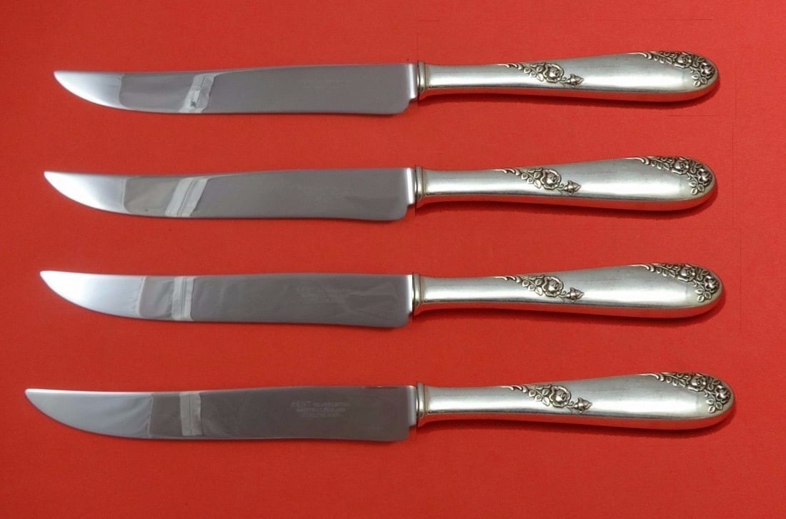 Lunt Sweetheart Rose Sterling Silver 4pc Texas Sized Steak Knives: Lunt Sweetheart Rose Sterling Silver 4pc Texas Sized Steak Knives This 4-piece set of steak knives features the Sweetheart Rose pattern by Lunt. Each knife has a sterling silver hollow handle paired w