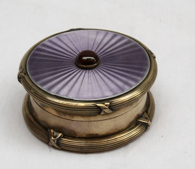 1924 English Enameled Sterling Silver Box with Garnet by T.E & Co: 1924 English Enameled Sterling Silver Box with Garnet by T.E & Co This exquisite 1924 English box showcases fine craftsmanship in sterling silver, featuring a stunning enameled garnet stone at its cen