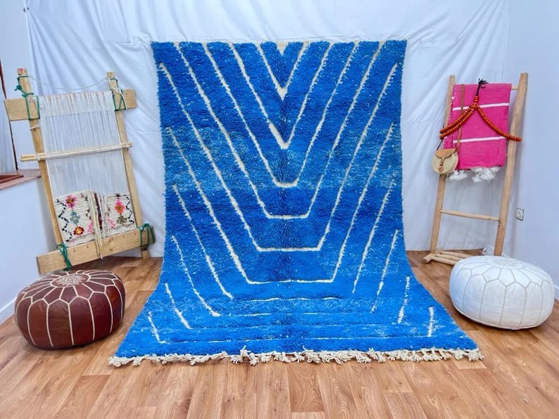 Authentic Bleu Engraved Wool Rug Handwoven in Morocco: Authentic Bleu Engraved Wool Rug Handwoven in Morocco Discover the beauty of this Elegant Authentic Blue Wool Rug, handwoven in the Atlas Mountains by skilled local Berber women weavers. This exquisit
