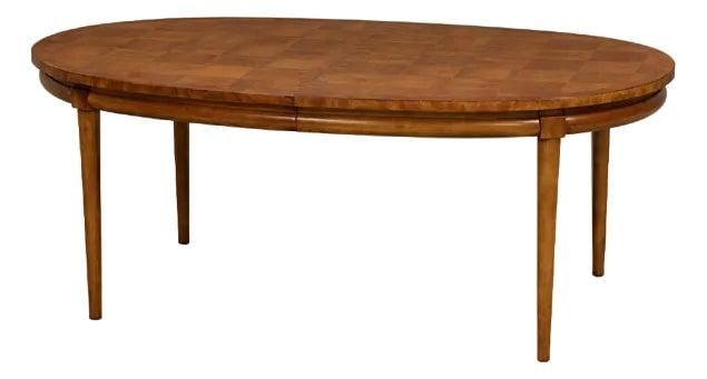 Thomasville Walnut Oval Dining Table with 2 Leaves: Thomasville Walnut Oval Dining Table with 2 Leaves This mid-century modern oval dining table by Thomasville Furniture features a walnut construction with elegant burl detailing around the border. The 