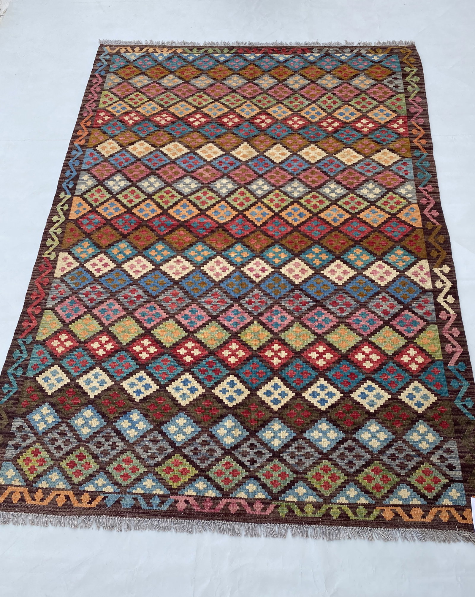 6 x 8 Handmade Multi-Color Ivory Kilim Rug from Afghanistan: 6 x 8 Handmade Multi-Color Ivory Kilim Rug from Afghanistan Free continental US Shipping Enhance your home with the vibrant charm of this 6' x 8' Multi-Color Ivory Kilim Rug. Handwoven by skilled arti
