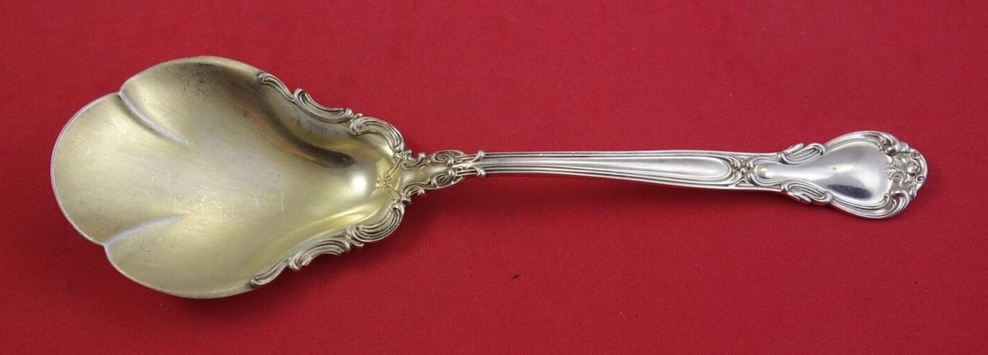 Gorham Chantilly Sterling Silver Berry Spoon Gold Wash 8 3/4": Gorham Chantilly Sterling Silver Berry Spoon Gold Wash 8 3/4" Discover the exquisite Chantilly Berry Spoon by Gorham, crafted from high-quality sterling silver. This elegant serving spoon features a b