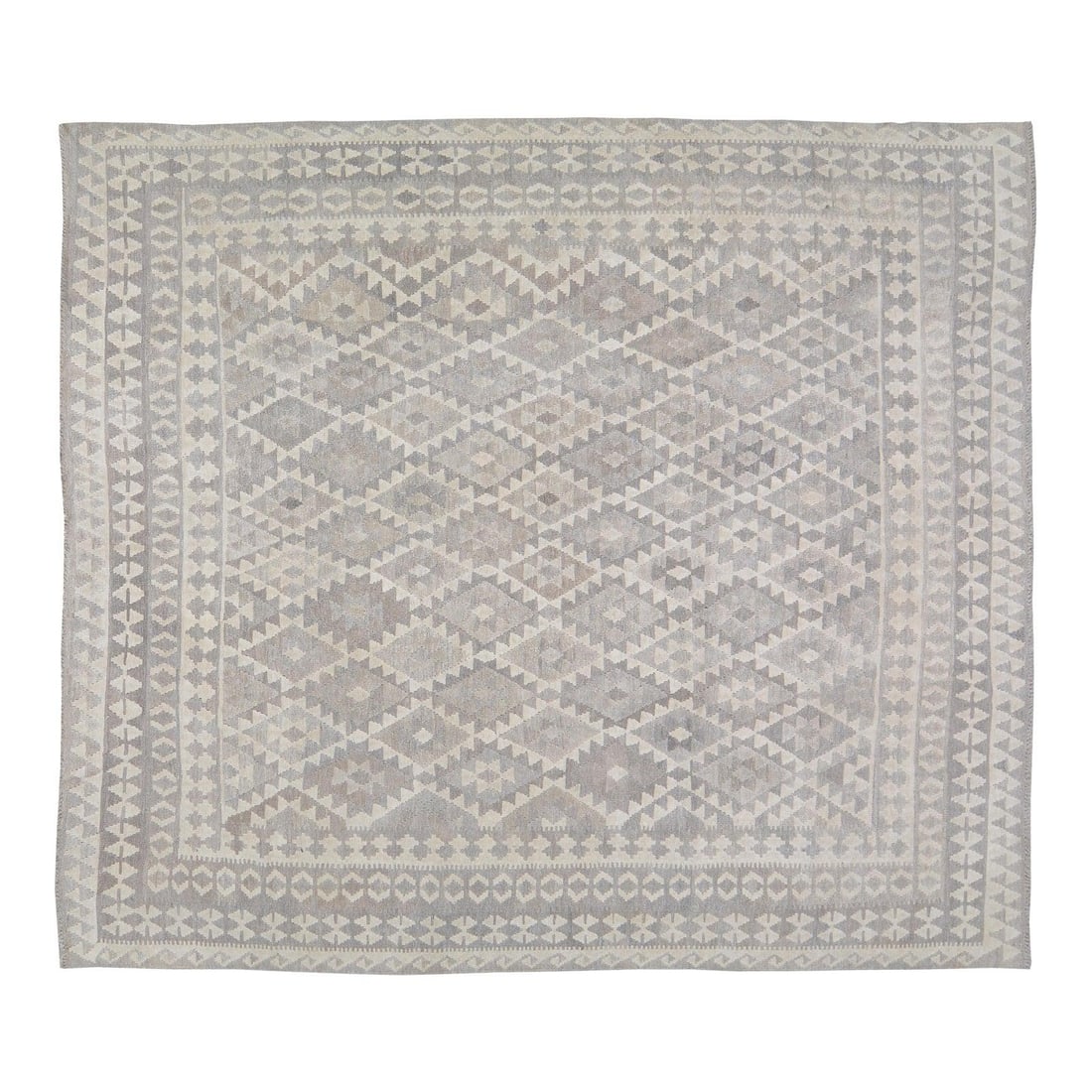 Wool Flatweave Kilim Rug in Navajo Style 8'2'' x 9'4'': Wool Flatweave Kilim Rug in Navajo Style 8'2'' x 9'4'' This Afghan Navajo style flatweave kilim is crafted from wool using traditional rug-making techniques. The rug features a timeless design that co