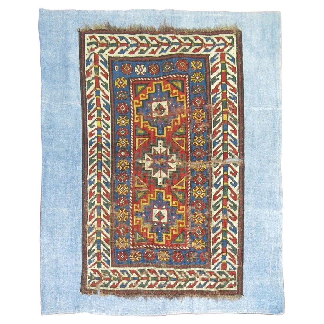 Late 19th Century Caucasian Kazak Rug on Turkish Kilim: Late 19th Century Caucasian Kazak Rug on Turkish Kilim This late 19th-century Caucasian Kazak rug is expertly hand-woven from wool and has been stitched onto a light blue Turkish kilim made from cotto