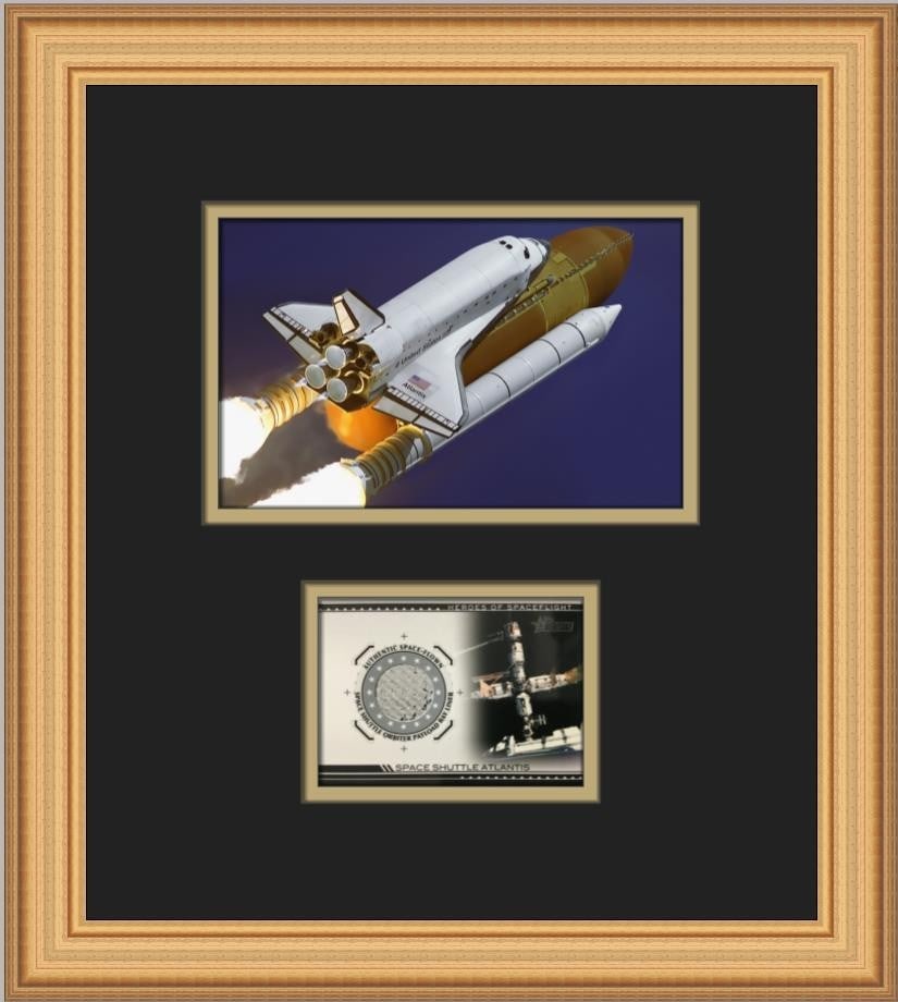 Framed Space Shuttle Atlantis Card With Flown Silver Bay Liner Segment 2009: Framed Space Shuttle Atlantis Card With Flown Silver Bay Liner Segment 2009 This custom framed display features a 2009 Topps American Heritage Heroes trading card for the Space Shuttle Atlantis. The c
