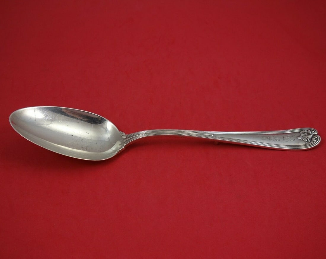 Tiffany & Co Colonial Sterling Silver Stuffing Spoon 11 inch: Tiffany & Co Colonial Sterling Silver Stuffing Spoon 11 inch This exquisite serving spoon, crafted by Tiffany & Co., showcases the timeless Colonial pattern. Made from high-quality sterling silver, th