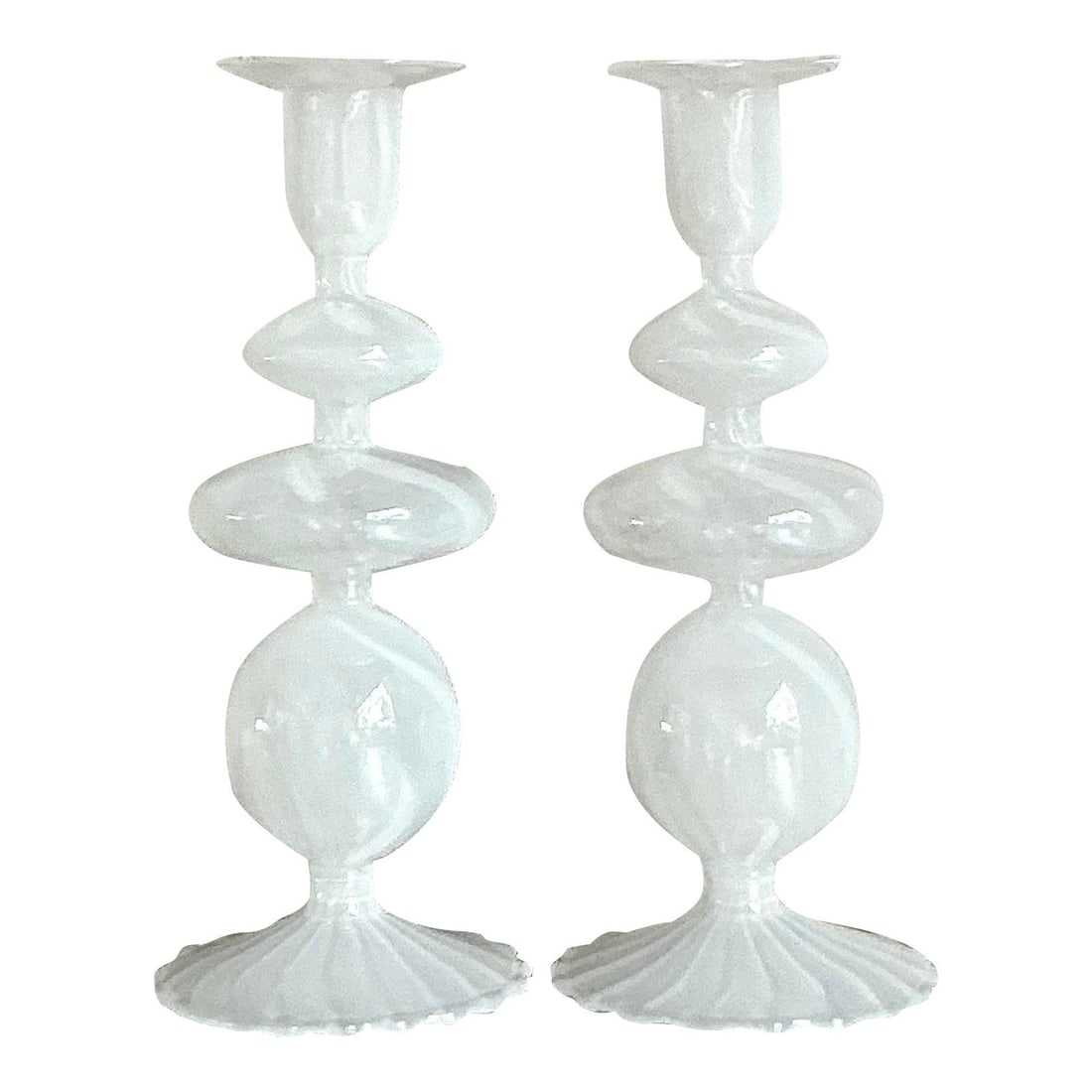 Pair of White Opaline Blown Glass Candlesticks in the Style of Murano: Pair of White Opaline Blown Glass Candlesticks in the Style of Murano This pair of vintage blown glass candlesticks, crafted in the style of Murano glassmakers and dating to the 1970s, features a lumi