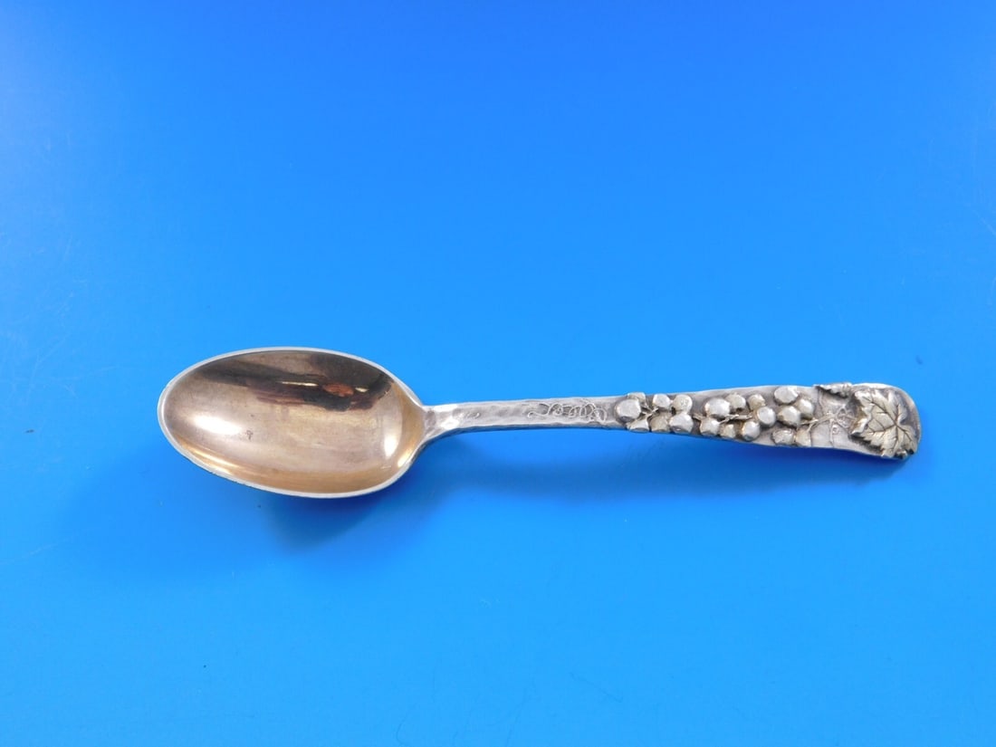 Tiffany & Co Lap Over Edge Sterling Silver Coffee Spoon with Grapes Vine: Tiffany & Co Lap Over Edge Sterling Silver Coffee Spoon with Grapes Vine This exquisite coffee spoon from Tiffany & Co. features the classic Lap Over Edge pattern, crafted from high-quality sterling s
