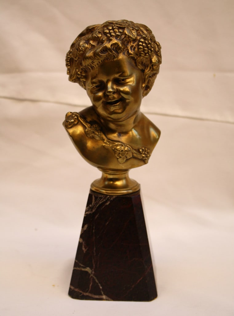 1900s Clodion Bronze Bust on Marble Base 1.75 inches Tall: 1900s Clodion Bronze Bust on Marble Base 1.75 inches Tall This exquisite original 1900's French bronze bust of a boy, signed "Clodion", is a stunning example of fine craftsmanship. The piece showcases
