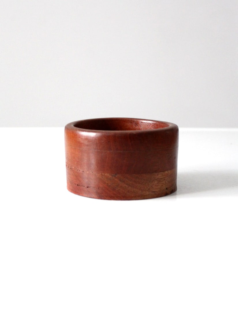 Handcrafted Vintage Wooden Bowl with Unique Tones 4.75in: Handcrafted Vintage Wooden Bowl with Unique Tones 4.75in Discover the charm of this vintage wooden bowl, meticulously hand-crafted with varying tones of wood that enhance its unique character. This bo