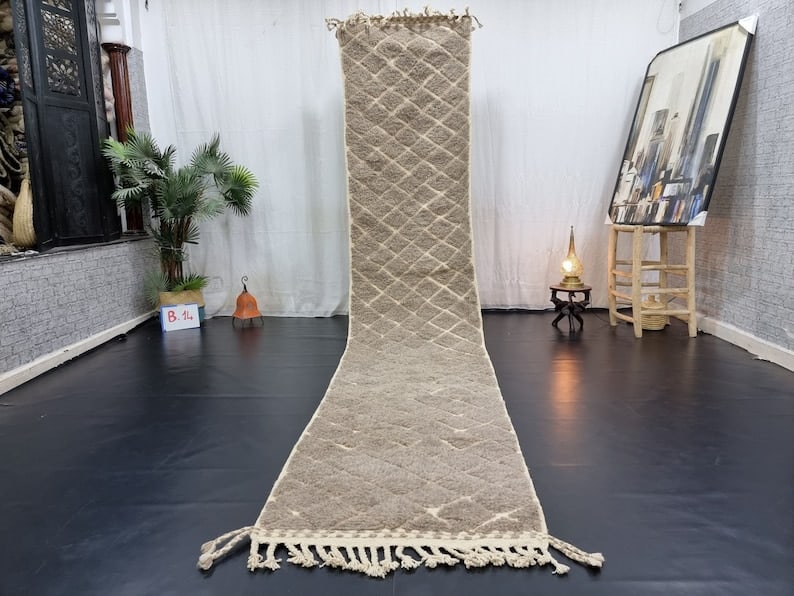 Authentic Moroccan 2 x 10 Feet Handwoven Geometric Wool Runner Rug: Authentic Moroccan 2 x 10 Feet Handwoven Geometric Wool Runner Rug Enhance your home decor with this Stylish Engraved Runner Rug, featuring a captivating geometric pattern. Handwoven in the Atlas Moun