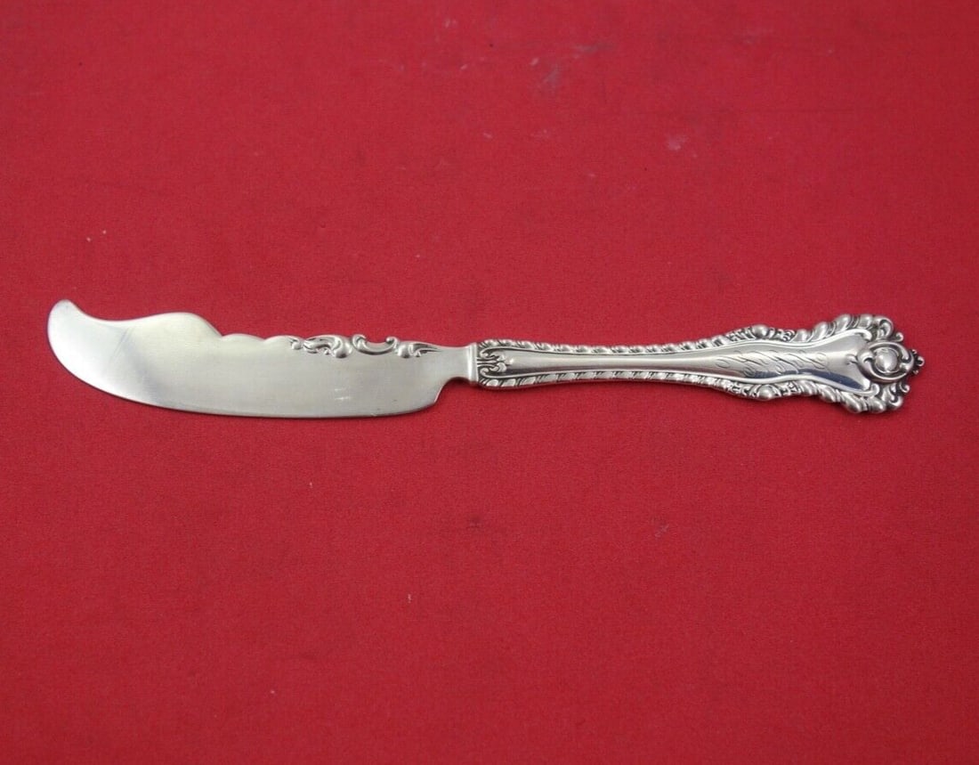 Dominick & Haff Mazarin Sterling Silver Butter Spreader 5 3/4": Dominick & Haff Mazarin Sterling Silver Butter Spreader 5 3/4" This exquisite butter spreader from the Mazarin pattern by Dominick & Haff is crafted from high-quality sterling silver. The flat handle 