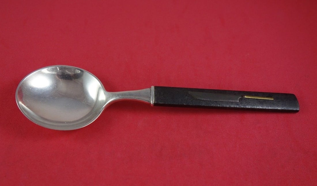 Tiffany & Co Kozuka Sterling Silver Bronze Gumbo Spoon 7 1/4": Tiffany & Co Kozuka Sterling Silver Bronze Gumbo Spoon 7 1/4" This exquisite Kozuka gumbo soup spoon is crafted by Tiffany & Co., featuring a unique bronze gilt handle and a luxurious sterling silver 