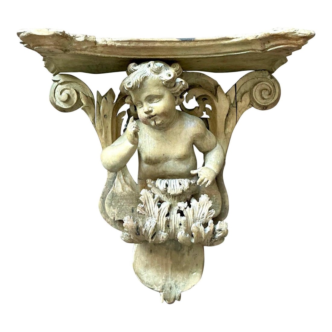 Hand-Carved Wooden Wall Bracket with Cherub and Acanthus Motif: Hand-Carved Wooden Wall Bracket with Cherub and Acanthus Motif This vintage wall bracket showcases exquisite Baroque-inspired ornamentation, hand-carved from wood with a natural taupe finish. The corb