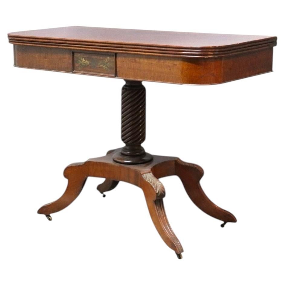 19th Century Federal Sheraton Flame Mahogany Game Table: 19th Century Federal Sheraton Flame Mahogany Game Table This antique Federal Sheraton card table, dating from the 19th century, is crafted from striking flame mahogany. The table features a rectangula