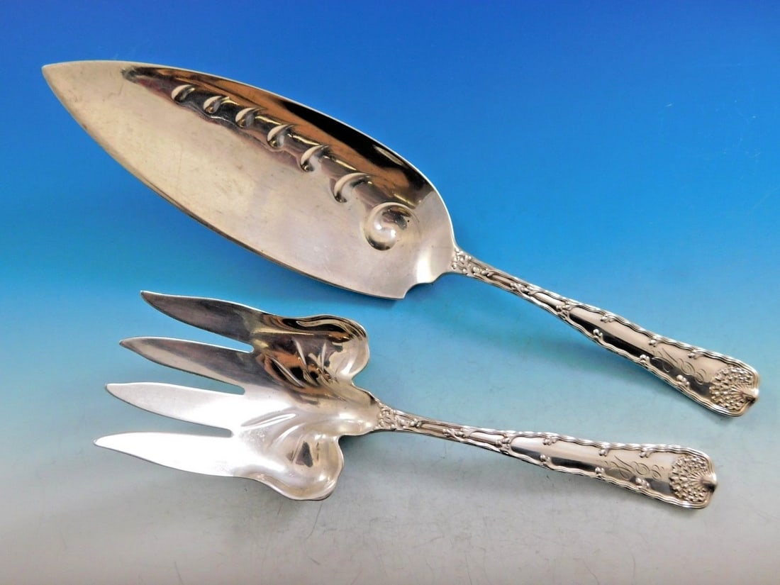 Tiffany Wave Edge sterling silver fish serving pair: Tiffany Wave Edge sterling silver fish serving pair This elegant two-piece fish serving set from Tiffany & Co. features the Wave Edge pattern, designed by Charles T. Grosjean and introduced in 1884. C