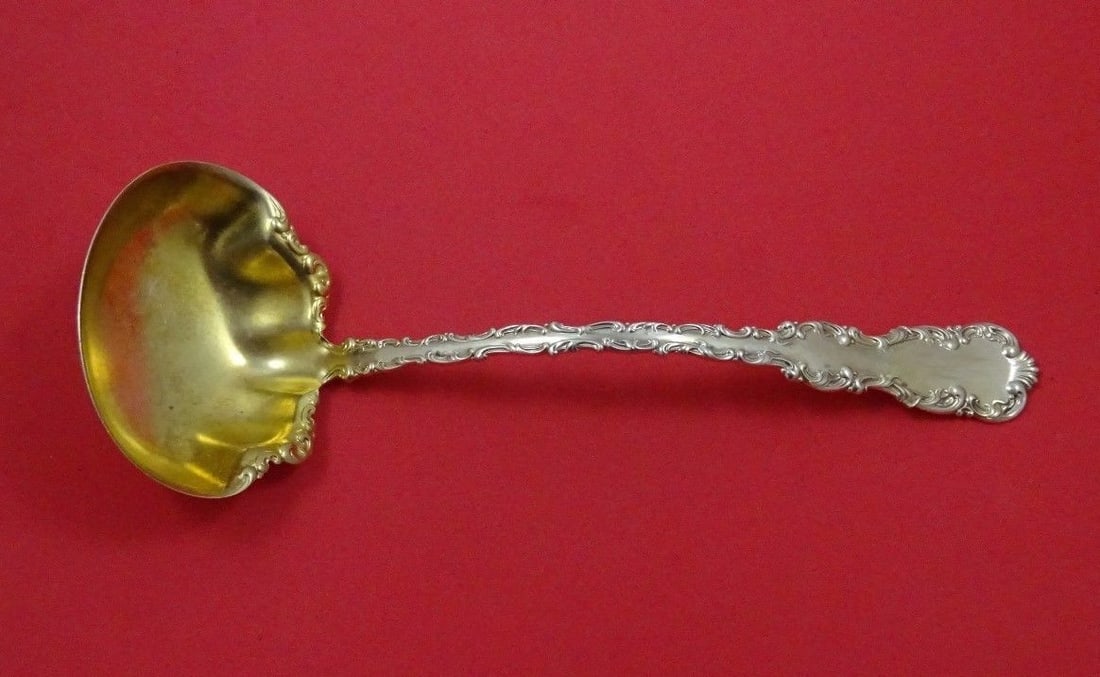 Whiting Louis XV Sterling Silver Gold Washed Oyster Ladle 10.5": Whiting Louis XV Sterling Silver Gold Washed Oyster Ladle 10.5" This exquisite oyster ladle is a luxurious piece from the Louis XV pattern by Whiting, crafted from high-quality sterling silver with a 