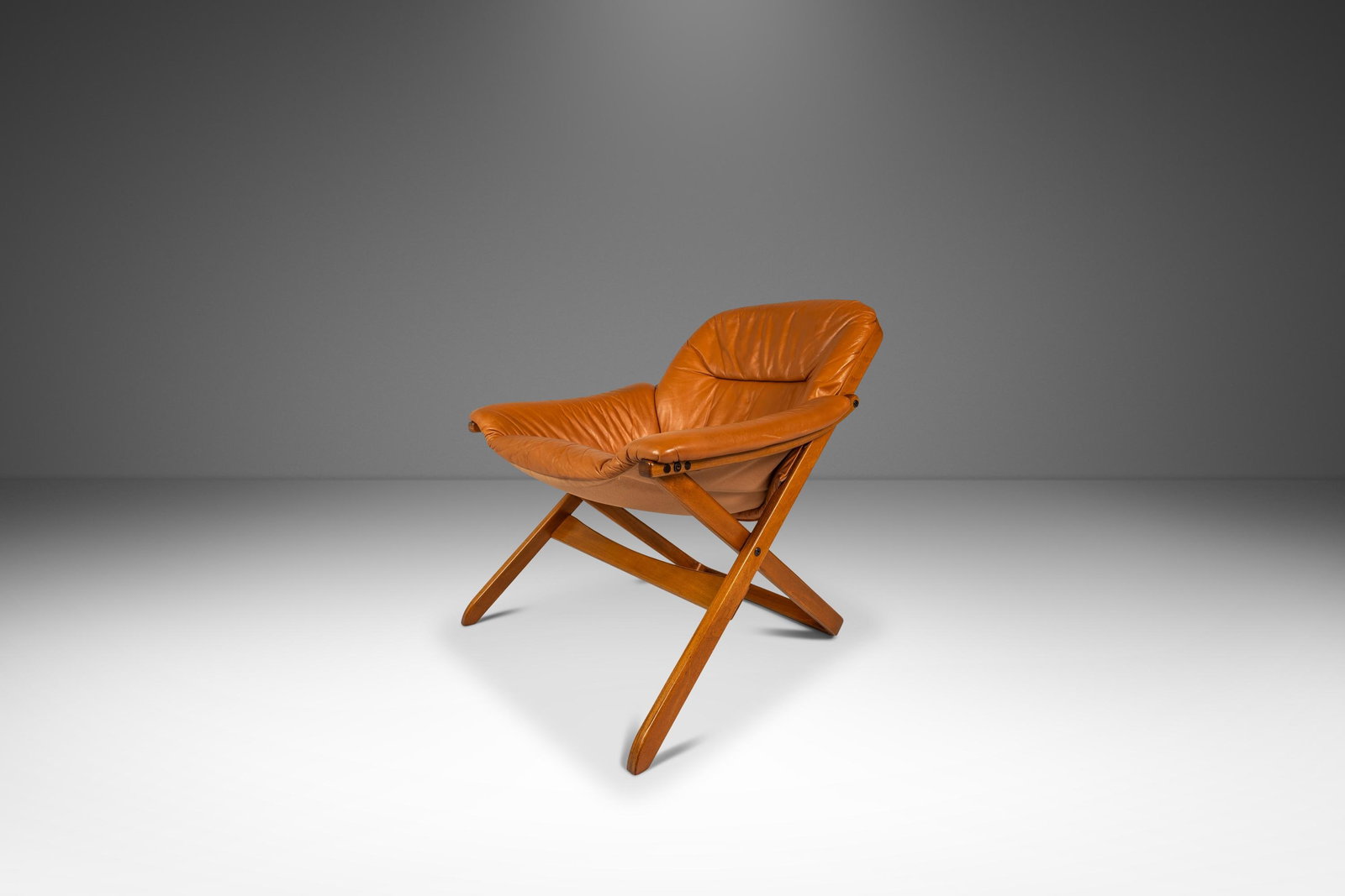 Gote Mobler Swedish leather beech lounge armchair 1970s: Gote Mobler Swedish leather beech lounge armchair 1970s This Scandinavian Modern armchair by Gote Mobler, crafted in Sweden circa 1970s, features a sculptural beech wood frame and original cognac-brow