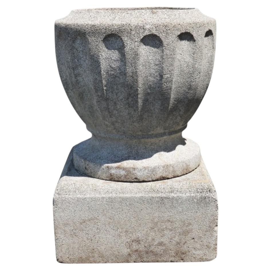 Cast stone fluted garden urn c1900: Cast stone fluted garden urn c1900 This antique garden urn, dating to around 1900, is crafted from cast hardstone with a natural speckled grey texture. Featuring a classical fluted bowl that gracefull