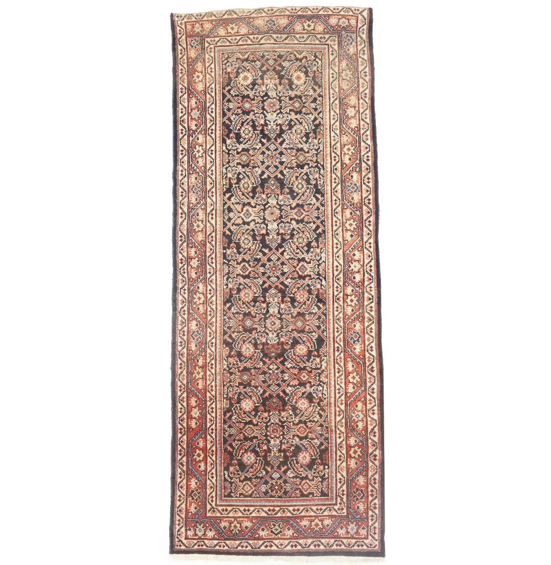 Hand Knotted Wool Floral Runner Rug 3'9 x 10'0: Hand Knotted Wool Floral Runner Rug 3'9 x 10'0 This hand-knotted Oriental runner rug features an allover floral design in muted tones including dark plum, coral red, cream, blue, and brown. Crafted fr