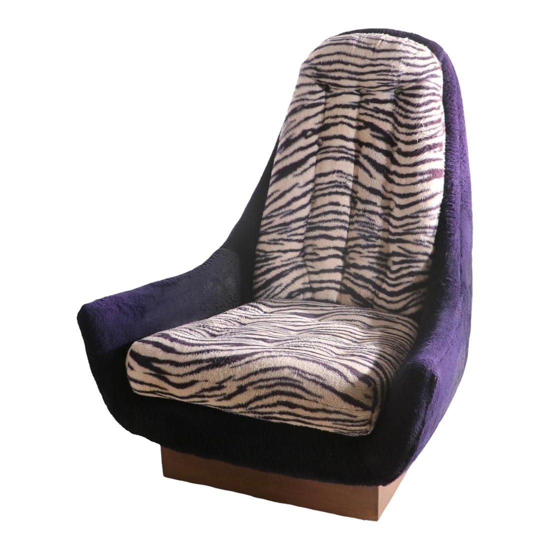 1970s Schnadig Swivel Lounge Chair Purple Faux Fur Zebra Cushions: 1970s Schnadig Swivel Lounge Chair Purple Faux Fur Zebra Cushions Embrace the vibrant essence of the 1970s with this retro swivel lounge chair, featuring a striking purple faux fur exterior complement