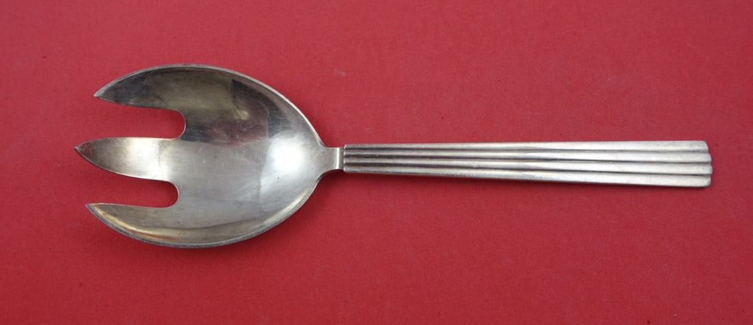 Georg Jensen Bernadotte Sterling Silver 3-Tine Salad Serving Fork 8": Georg Jensen Bernadotte Sterling Silver 3-Tine Salad Serving Fork 8" This exquisite salad serving fork is part of the Bernadotte pattern by Georg Jensen. Crafted from high-quality sterling silver, thi