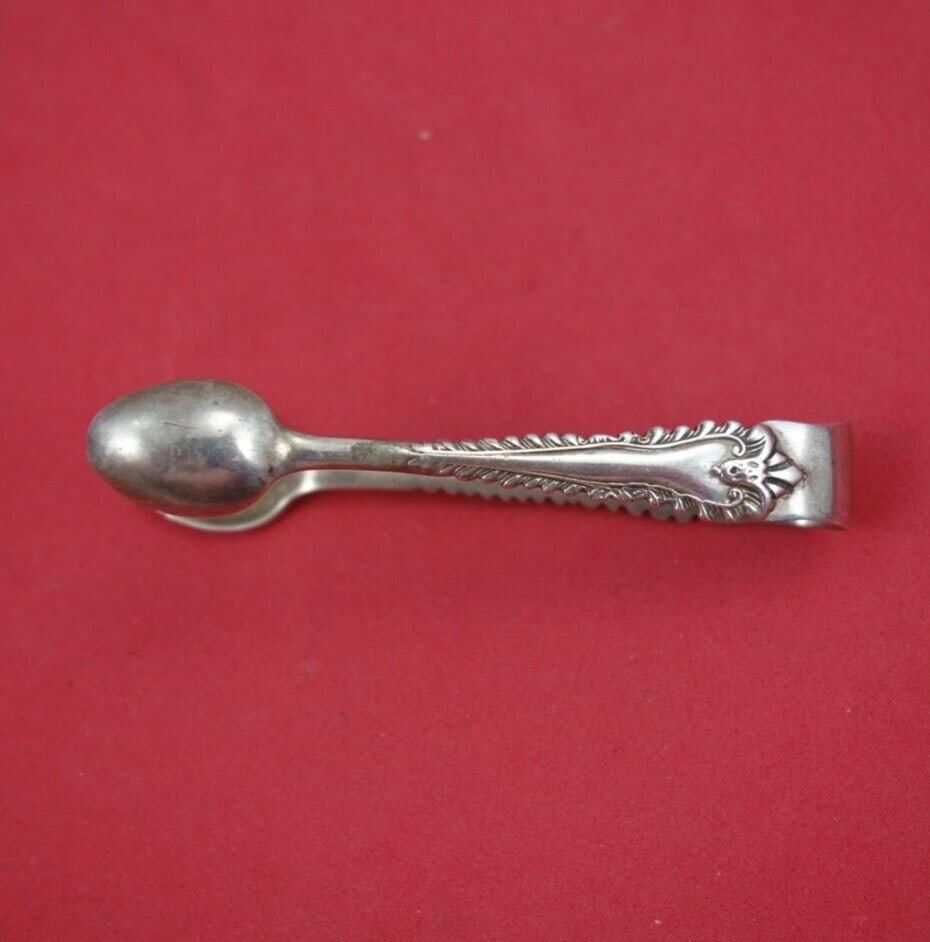 1909 English Sterling Silver Sugar Tongs by Jackson & Fullerton 2 7/8": 1909 English Sterling Silver Sugar Tongs by Jackson & Fullerton 2 7/8" This exquisite English estate sterling silver sugar tong, also known as a 'tete a teta' tong, was crafted in London in 1909 by re