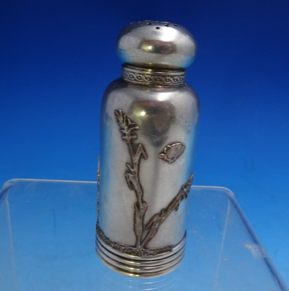 Gorham Sterling Silver Pepper Shaker #1660 Japonesque Woman Design: Gorham Sterling Silver Pepper Shaker #1660 Japonesque Woman Design This exquisite Gorham pepper shaker, crafted in the Applied Metals pattern, showcases a stunning design that includes an applied moth
